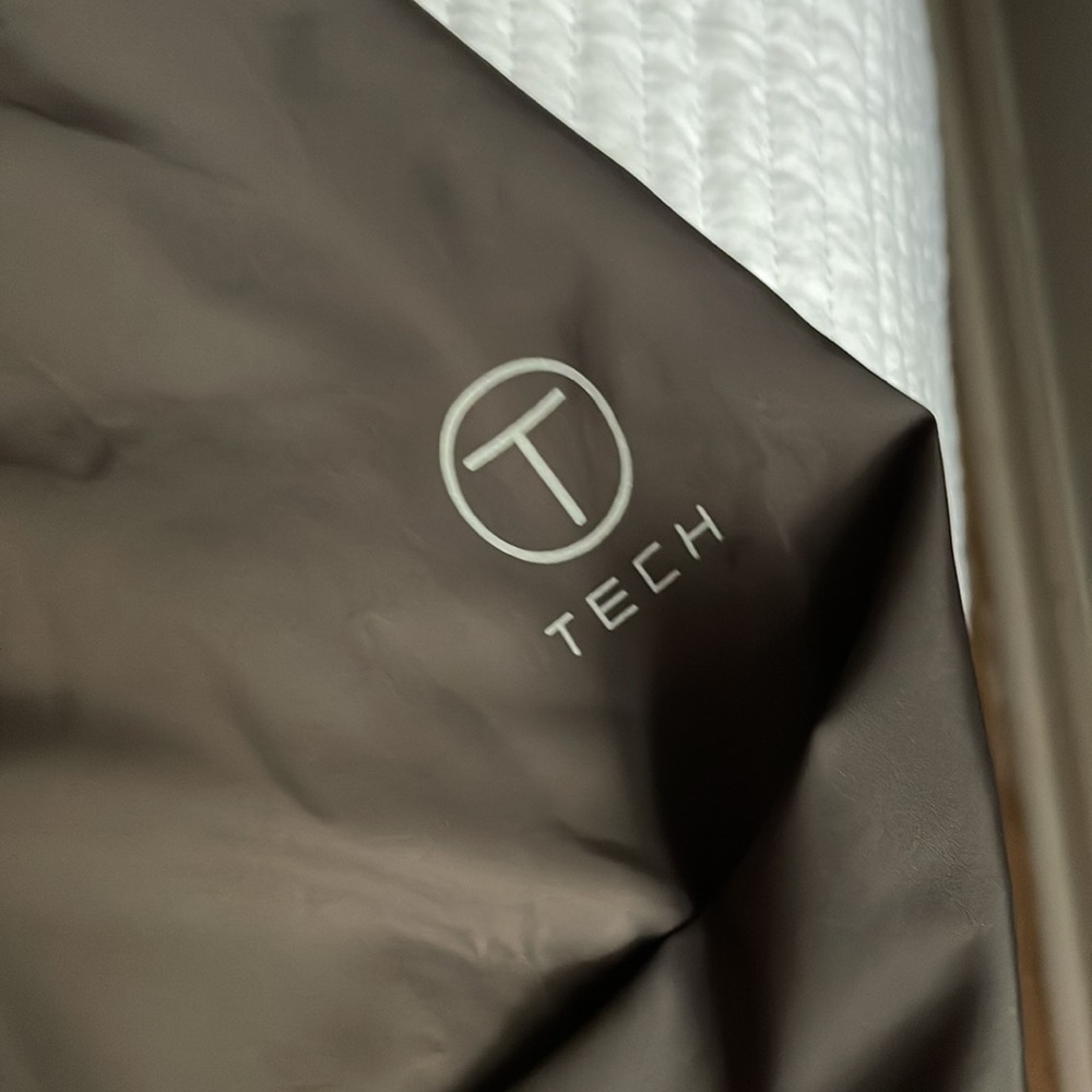 Beautiful light brown jacket Tumi brand used, but in exceptional condition